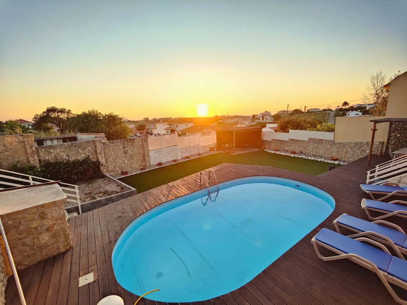 Sunset over the pool at the surfcamp house