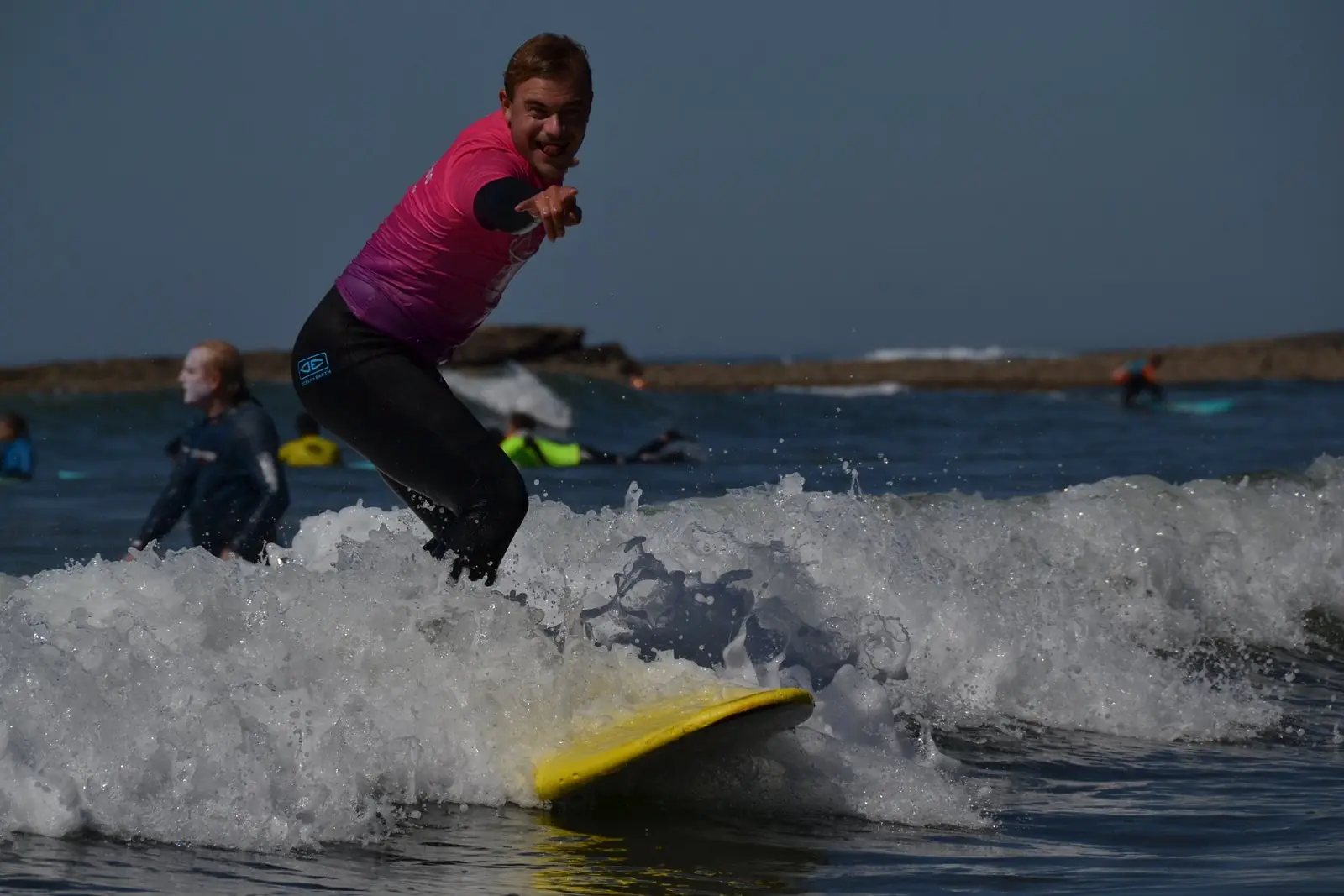Surfer popping up on a wave in Ericeira
