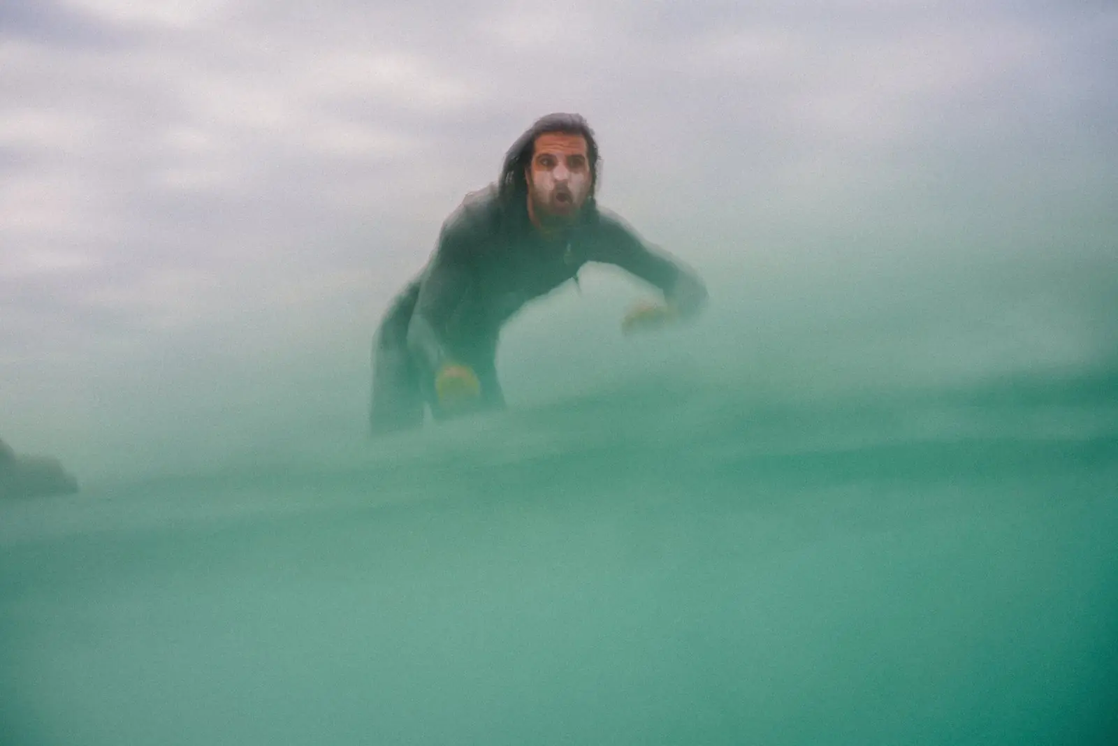 Simone, founder of Dolce Vita Ericeira, surfing in the Atlantic