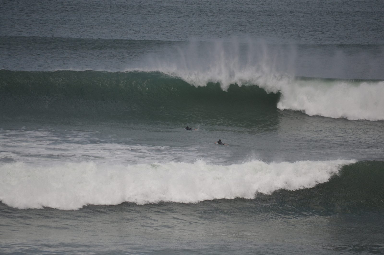Surfers in the lineup at an Ericeira break